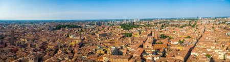A panoramic aerial shot of buildings and streets of old town Bologna, Italy