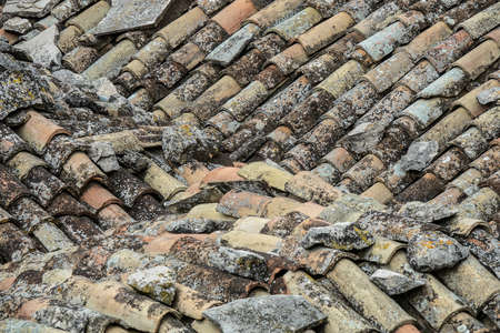 A closeup shot of a roof of a building made of polluted stonesの写真素材