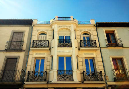 A top view shot of a yellow two-storied house in Alcala de Henares, Spainの写真素材