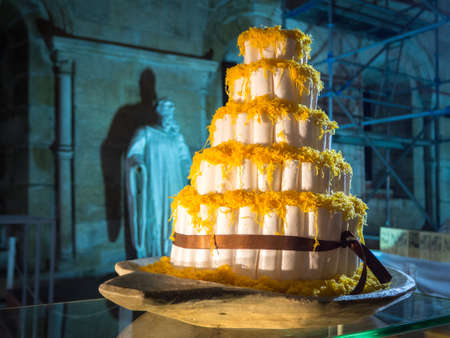 A beautiful big cake with a lot of layers with a blurred backgroundの写真素材
