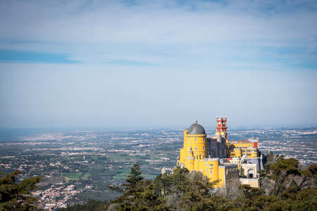 The castle in Sintra Cascais surrounded by greenery under the sunlight and a blue sky in Portugalのeditorial素材