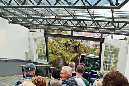 BERGEN, NORWAY - Jul 07, 2019: Tourists wait for the famous Mount Floyen funicular to arrive which transports tourists and locals to the top of the mountain.のeditorial素材