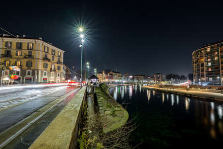 A beautiful shot of a clear night sky in the dock of navigli in milan italyのeditorial素材