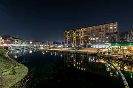 A beautiful shot of a clear night sky in the dock of navigli in milan italyのeditorial素材