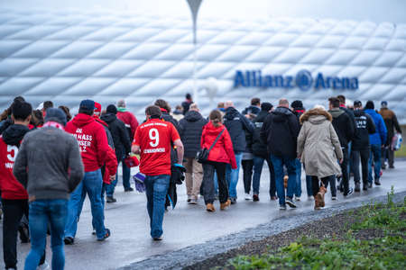 MUNICH, GERMANY - Oct 05, 2019: Fans of famous football soccer club FC Bayern MÃ¼nchen playing in german bundesliga and champions league walking to Allianz Arena home stadiumのeditorial素材