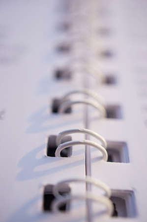A vertical closeup shot of white notebook springsの写真素材