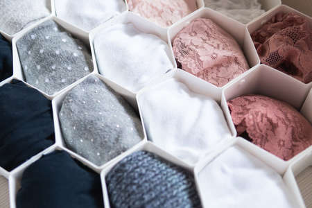 A beautiful shot of different kinds of fabrics separated by white plastic pieces