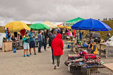 GUDAURI, GEORGIA - Sep 26, 2019: Georgian entrepreneurs selling goods near the friendship monument (a popular tourist attraction in the area).のeditorial素材