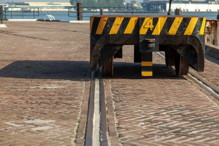 An old rusty car trailer at Harbor of Rotterdam during daytime