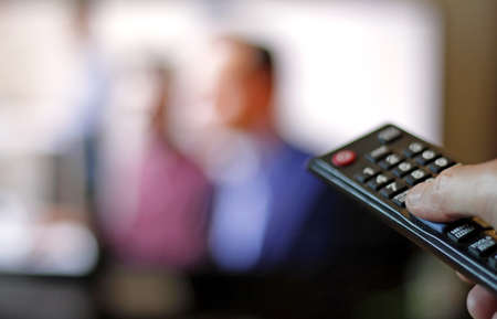 A person using the television remote
