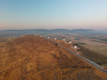 A high angle panoramic shot of the beautiful windmills on top of a hill in Consuegra, Spainの写真素材