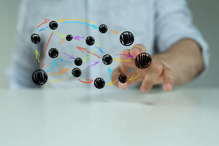 A person creating a virtual projection of the partnership network - teamwork and partnership concept