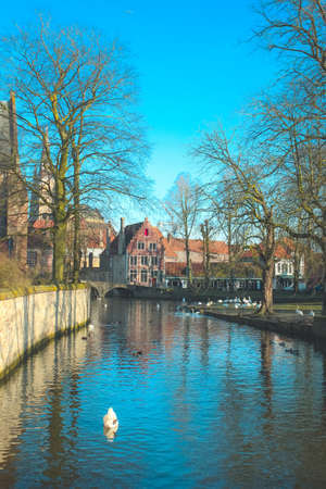 BRUGES, BELGIUM - Feb 17, 2014: The scenery with a water canal in Bruges, "Venice of the North", cityscape of Flanders, Belgium.のeditorial素材