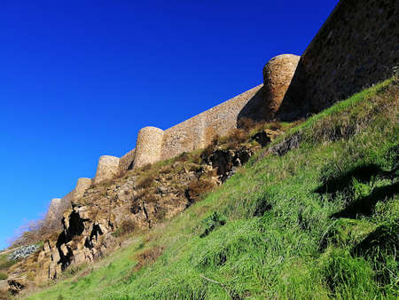 A bottom view shot of castle walls and towers on the hill in Toledo, Spainのeditorial素材