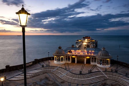 CROMER, NORTH NORFOLK, UK, UNITED KINGDOM - Jun 11, 2013: High view of the magnificent Cromer pier at sunsetのeditorial素材