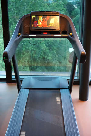 MERANO, ITALY - Jan 01, 2020: A treadmill machine at a gym with no personのeditorial素材