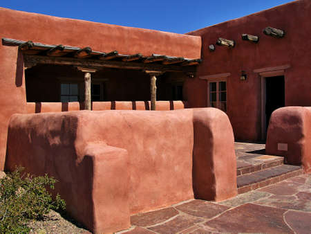 WINSLOW, AZ, UNITED STATES - Jun 23, 2012: A red adobe house in the desert.のeditorial素材