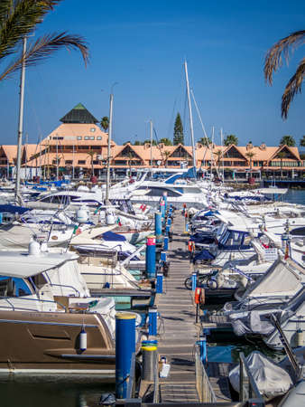 VILAMOURA, PORTUGAL - May 25, 2019: View of yachts in the marina with buildings to the rear, Vilamoura, Algarve, Portugalのeditorial素材