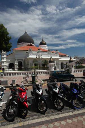 GEORGE TOWN, PENANG, MALAYSIA - Feb 20, 2012: Mopeds outside a mosque in the center of George town in Malaysia.のeditorial素材