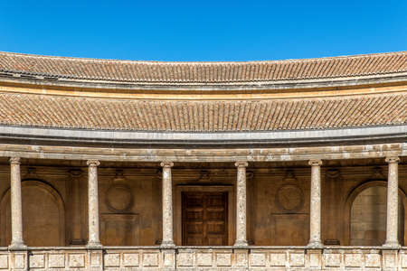 A closeup shot of the Palace of Charles V in Granada, Spain under a blue skyのeditorial素材