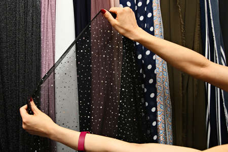 A fashion designer working in her studio workshop.の写真素材
