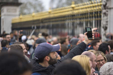 LONDON, UNITED KINGDOM - Apr 13, 2019: Tourist people in front of palace in London.のeditorial素材