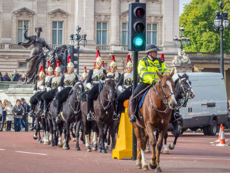 LONDON, UNITED KINGDOM - Oct 09, 2017: LONDON - OCTOBER 9 - horses mounted soldiers of the Household Cavalry performs the Changing the Guard ceremony in traditional uniformのeditorial素材