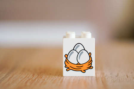 POZNAN, POLAND - May 14, 2016: White Lego Duplo block with egg illustration.のeditorial素材