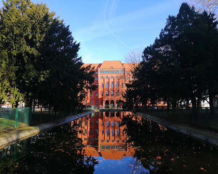 A beautiful scenery of a historic building reflecting on the water surface in Szczecin, Polandのeditorial素材
