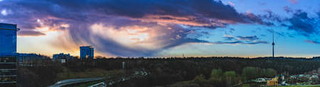A panoramic shot of the breathtaking sunset with the colorful sky in Vilnus, Lithuaniaのeditorial素材