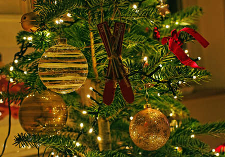 A beautifully decorated Christmas tree with string lights and unique ornaments - Christmas concept