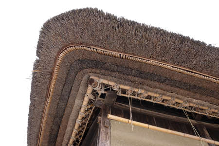 A lo angle shot of a thatched roofing of a traditional Japanese houseの写真素材