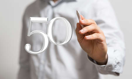 A person presenting a virtual projection of the digital number fifty