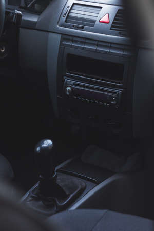 The interior of a car with a steering wheel and a speedometerの写真素材