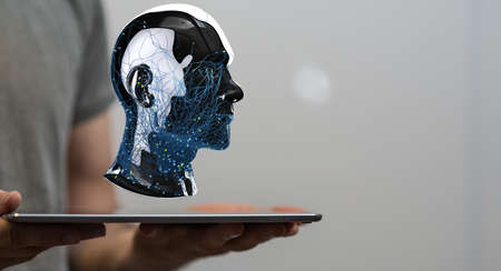 A human hand presenting a digital puzzle projection of a human head