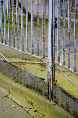 A closeup shot of a rusty  locked gate