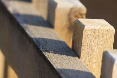 An extreme closeup of the the top of a balk fence in a farmの写真素材