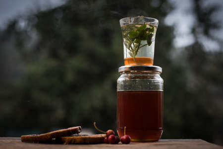 A closeup shot of a healthy homemade drink in a jar with a blurry backgroundの写真素材