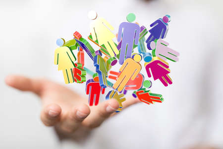 A human hand presenting the digital projection of colorful people networkの写真素材