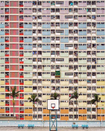 HONG KONG, CHINA - Jun 01, 2018: Hong Kong minimal pastel facade of Choi Hung Estate, seats and...