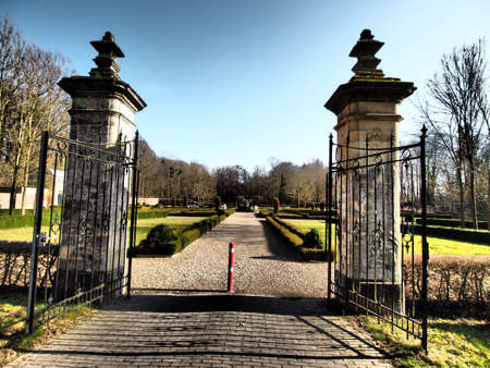 The opened gates of the entrance of the park during daytimeの写真素材