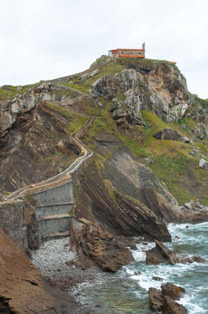 The mesmerizing view of the rocky mountain in San Juan de Gaztelugatxe in Bermeo, Spainの写真素材