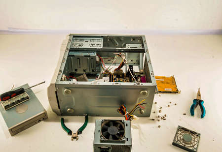A process of computer repairing with a disassembled computer case