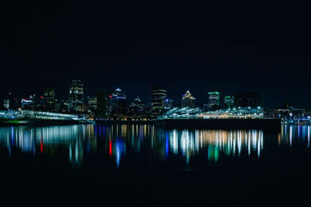 A beautiful Dieppe Park port night skyline with colorful light reflections on the riverの写真素材