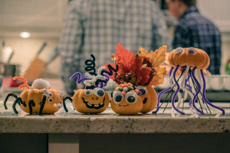 A closeup shot of googly pumpkin Halloween table