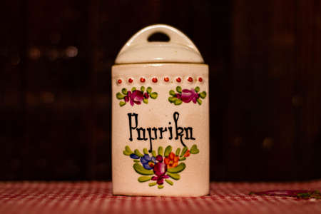 A beautiful shot of a spice jar painted with different colors on a table