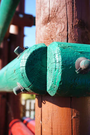 A vertical closeup of colorful wooden fences under the lights with a blurry backgroundの写真素材