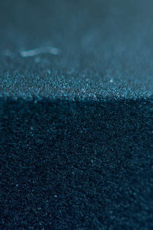 A macro shot of texture in a plastic object with a blurred backgroundの写真素材