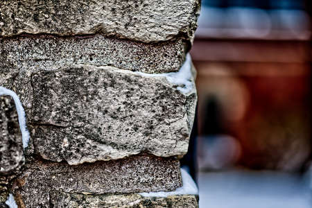 A closeup shot of a brick wall with snow on itの写真素材