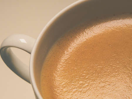 closeup of a cup of coffee on a white backgroundの写真素材